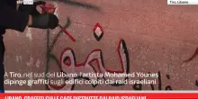 Libano, graffiti sulle case distrutte dai raid israeliani