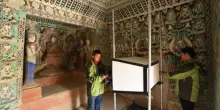 Cina, restauratori al lavoro per preservare le grotte di Mogao