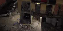 I muri crollati, gli infissi devastati: i danni dopo l'esplosione in un condominio a Bergamo