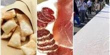 Tavolata più lunga del mondo, il record: oltre 2,5 Km di persone sedute a pranzo. Serviti gnocco fritto e salumi